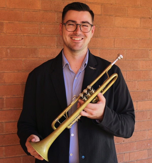 Alexander Strawn holding trumpet